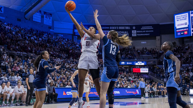 STORRS, CONNECTICUT - JANUARY 15: Sarah Strong #21 of the Connecticut Huskies drives to the rim against Brynn McCurry #13 of the Villanova Wildcats during the second half of an NCAA women's basketball game at Harry A. Gampel Pavilion on January 15, 2026 in Storrs, Connecticut.