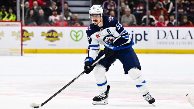 OTTAWA, CANADA - JANUARY 03: Mark Scheifele #55 of the Winnipeg Jets handles the puck during the third period against the Ottawa Senators at Canadian Tire Centre on January 3, 2026 in Ottawa, Ontario, Canada. The Ottawa Senators defeated the Winnipeg Jets 4-2.