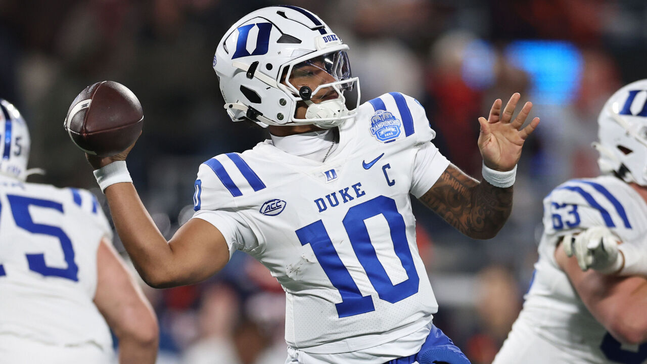 CHARLOTTE, NORTH CAROLINA - DECEMBER 06: Darian Mensah #10 of the Duke Blue Devils passes the ball during the third quarter against the Virginia Cavaliers in the 2025 ACC Football Championship at Bank of America Stadium on December 06, 2025 in Charlotte, North Carolina.
