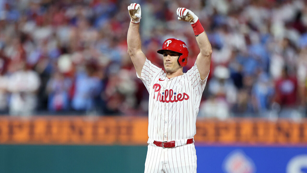 PHILADELPHIA, PENNSYLVANIA - OCTOBER 06: J.T. Realmuto #10 of the Philadelphia Phillies celebrates after hitting a double during the ninth inning against the Los Angeles Dodgers in game two of the National League Division Series at Citizens Bank Park on October 06, 2025 in Philadelphia, Pennsylvania.