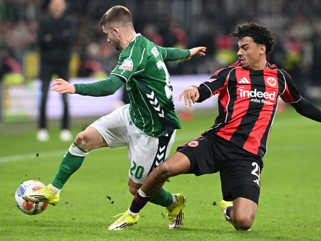 16 January 2026, Bremen: Soccer: Bundesliga, Werder Bremen - Eintracht Frankfurt, Matchday 18, Weserstadion. Romano Schmid (Werder Bremen) fights for the ball against Nathaniel Brown (Eintracht Frankfurt). Photo: --/dpa - IMPORTANT NOTE: In accordance with the regulations of the DFL German Football League and the DFB German Football Association, it is prohibited to utilize or have utilized photographs taken in the stadium and/or of the match in the form of sequential images and/or video-like photo series.