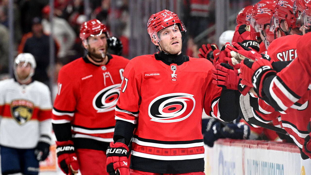 RALEIGH, NC - JANUARY 16: Left Wing Nikolaj Ehlers (27) of the Carolina Hurricanes fist bumps teammates after scoring during the NHL game between the Florida Panthers and the Carolina Hurricanes on January 16, 2026 at Lenovo Center in Raleigh, North Carolina.