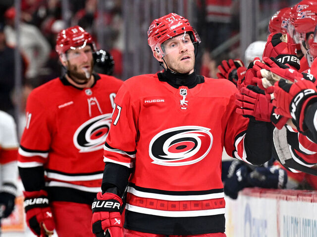 RALEIGH, NC - JANUARY 16: Left Wing Nikolaj Ehlers (27) of the Carolina Hurricanes fist bumps teammates after scoring during the NHL game between the Florida Panthers and the Carolina Hurricanes on January 16, 2026 at Lenovo Center in Raleigh, North Carolina.
