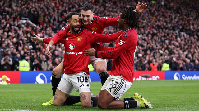 MANCHESTER, ENGLAND - JANUARY 17: Patrick Dorgu of Manchester United celebrates after he scores a goal to make it 2-0 with Matheus Cunha and Diogo Dalot of Manchester United during the Premier League match between Manchester United and Manchester City at Old Trafford on January 17, 2026 in Manchester, England.