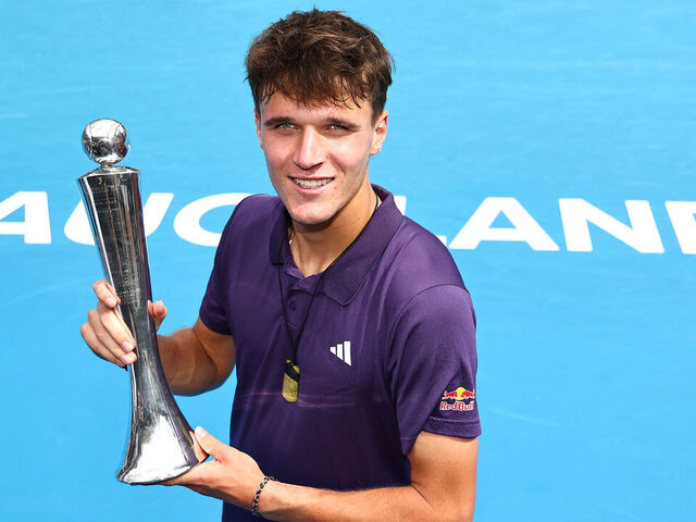 AUCKLAND, NEW ZEALAND - JANUARY 17: Jakub Mensik of Czech Republic with the trophy after victory in the singles final defeating Sebastian Baez of Argentina during day 13 of the 2026 ASB Classic at ASB Tennis Centre on January 17, 2026 in Auckland, New Zealand.
