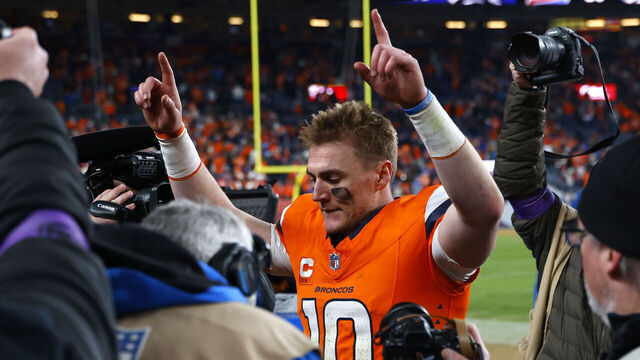 DENVER, COLORADO - JANUARY 17: Bo Nix #10 of the Denver Broncos celebrates after defeating the Buffalo Bills with a score of 30 to 33 in overtime of the AFC Divisional Playoff game at Empower Field At Mile High on January 17, 2026 in Denver, Colorado.