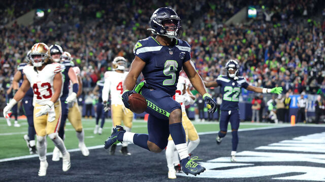SEATTLE, WASHINGTON - JANUARY 17: Kenneth Walker III #9 of the Seattle Seahawks scores a touchdown during the fourth quarter against the San Francisco 49ers in the NFC Divisional Playoff game at Lumen Field on January 17, 2026 in Seattle, Washington.