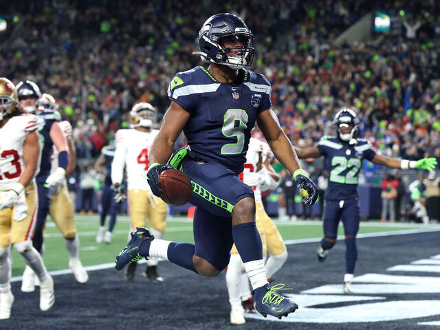 SEATTLE, WASHINGTON - JANUARY 17: Kenneth Walker III #9 of the Seattle Seahawks scores a touchdown during the fourth quarter against the San Francisco 49ers in the NFC Divisional Playoff game at Lumen Field on January 17, 2026 in Seattle, Washington.