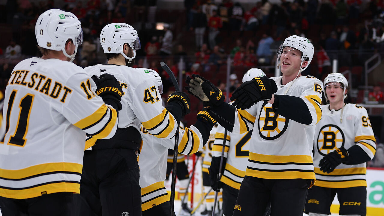 CHICAGO, IL - JANUARY 17: Mason Lohrei #6 of the Boston Bruins celebrates with teammates after a game against the Chicago Blackhawks on January 17, 2026 at the United Center in Chicago, Illinois.