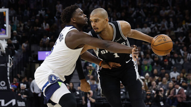 SAN ANTONIO, TX - JANUARY 17: Victor Wembanyama #1 of the San Antonio Spurs drives on Anthony Edwards #5 of the Minnesota Timberwolves in the second half at Frost Bank Center on January 17, 2026 in San Antonio, Texas. NOTE TO USER: User expressly acknowledges and agrees that, by downloading and or using this photograph, User is consenting to terms and conditions of the Getty Images License Agreement.