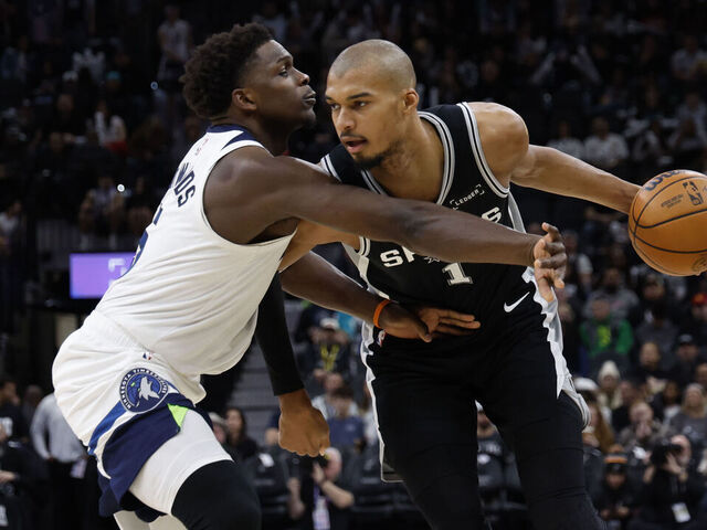 SAN ANTONIO, TX - JANUARY 17: Victor Wembanyama #1 of the San Antonio Spurs drives on Anthony Edwards #5 of the Minnesota Timberwolves in the second half at Frost Bank Center on January 17, 2026 in San Antonio, Texas. NOTE TO USER: User expressly acknowledges and agrees that, by downloading and or using this photograph, User is consenting to terms and conditions of the Getty Images License Agreement.