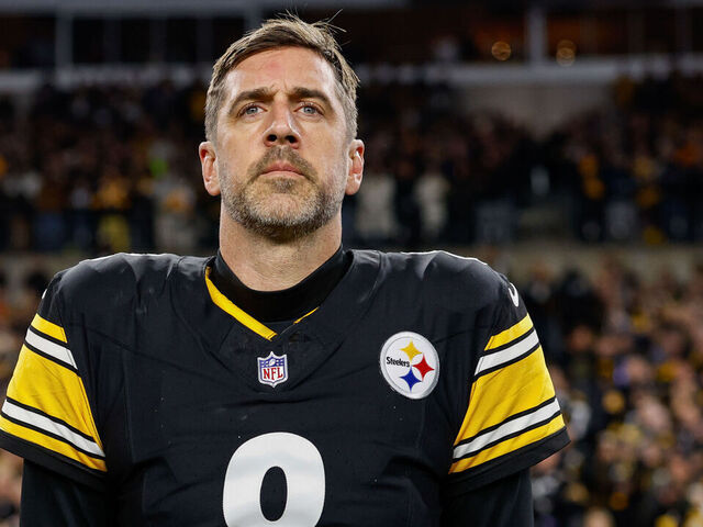 PITTSBURGH, PENNSYLVANIA - JANUARY 12: Aaron Rodgers #8 of the Pittsburgh Steelers stands for the national anthem prior to the AFC Wild Card playoff game against the Houston Texans at Acrisure Stadium on January 12, 2026 in Pittsburgh, Pennsylvania.