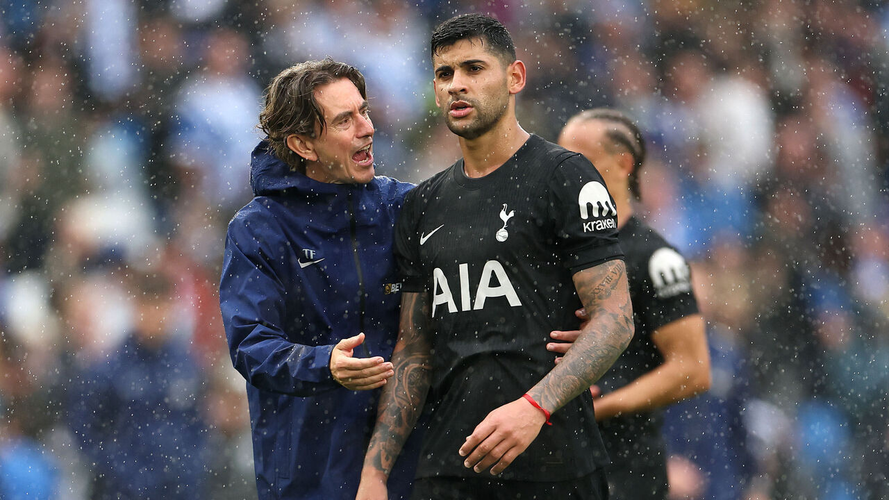 BRIGHTON, ENGLAND - SEPTEMBER 20: Thomas Frank, Manager of Tottenham Hotspur, talks with Cristian Romero of Tottenham Hotspur after the Premier League match between Brighton & Hove Albion and Tottenham Hotspur at Amex Stadium on September 20, 2025 in Brighton, England.