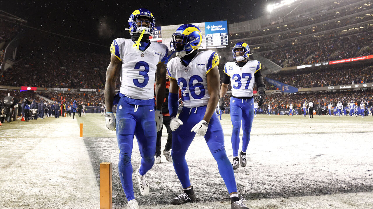 CHICAGO, ILLINOIS - JANUARY 18: Kam Curl #3 of the Los Angeles Rams celebrates after his interception against the Chicago Bears with Kamren Kinchens #26 during overtime in the NFC Divisional Playoffs at Soldier Field on January 18, 2026 in Chicago, Illinois.