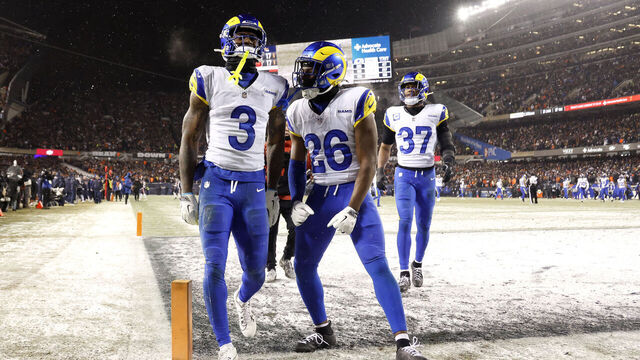CHICAGO, ILLINOIS - JANUARY 18: Kam Curl #3 of the Los Angeles Rams celebrates after his interception against the Chicago Bears with Kamren Kinchens #26 during overtime in the NFC Divisional Playoffs at Soldier Field on January 18, 2026 in Chicago, Illinois.