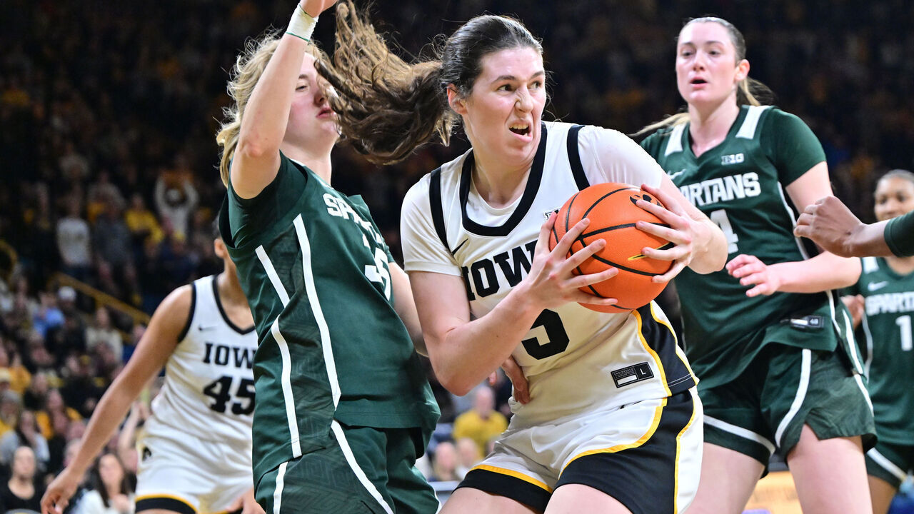 IOWA CITY, IA - JANUARY 18: Iowa center Ava Heiden (5)] grabs a rebound against Michigan State guard Kennedy Blair (35) during a Big Ten Conference women's basketball game between the Michigan State Spartans and the Iowa Hawkeyes, on Jan. 18, 2026, at Carver-Hawkeye Arena in Iowa City, IA.