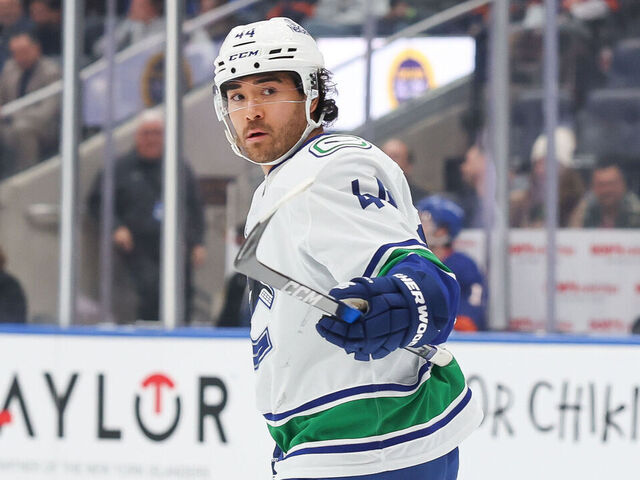 ELMONT, NEW YORK - DECEMBER 19: Kiefer Sherwood #44 of the Vancouver Canucks celebrates after scoring a goal during the first period of an NHL game against the New York Islanders at UBS Arena on December 19, 2025 in Elmont, New York.