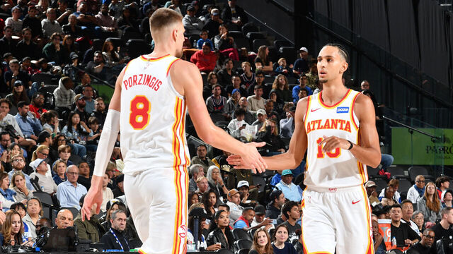 INGLEWOOD, CA - NOVEMBER 10: Zaccharie Risacher #10 and Kristaps Porzingis #8 of the Atlanta Hawks high five during the game against the LA Clippers on November 10, 2025 at Intuit Dome in Los Angeles, California. NOTE TO USER: User expressly acknowledges and agrees that, by downloading and/or using this Photograph, user is consenting to the terms and conditions of the Getty Images License Agreement. Mandatory Copyright Notice: Copyright 2025 NBAE