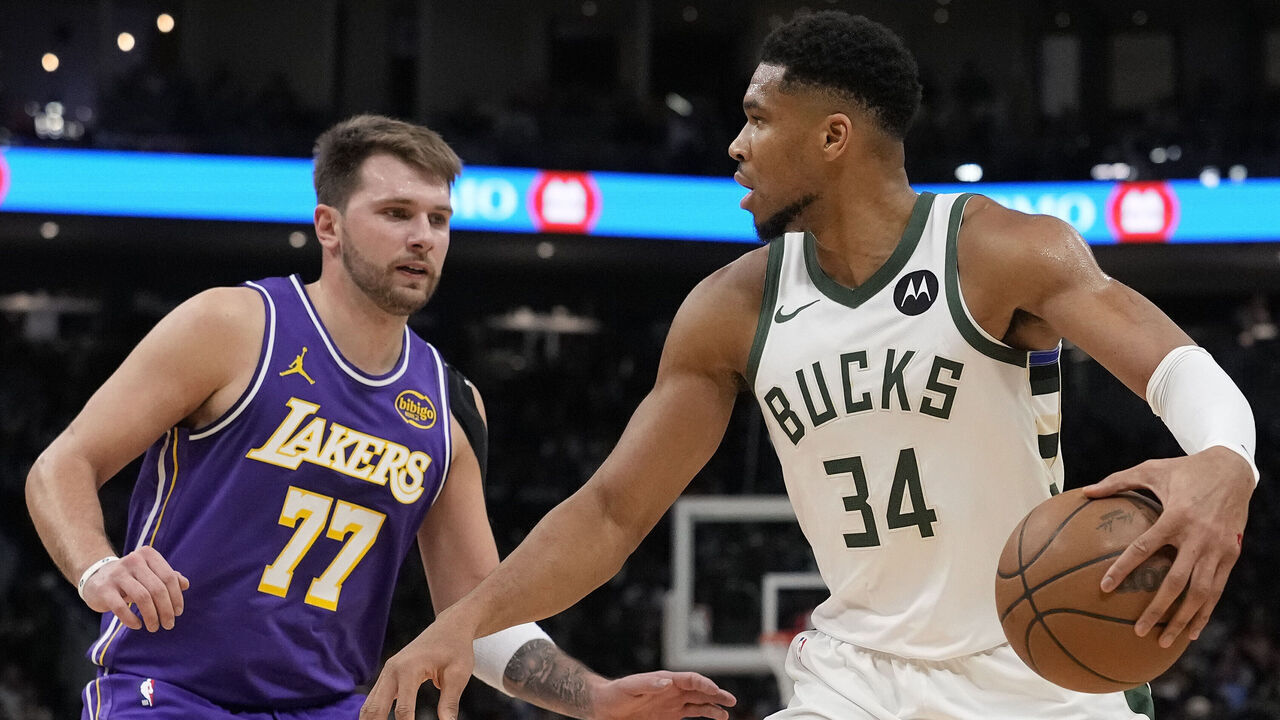 MILWAUKEE, WISCONSIN - NOVEMBER 15: Giannis Antetokounmpo #34 of the Milwaukee Bucks dribbles the ball against Luka Doncic #77 of the Los Angeles Lakers during the third quarter at Fiserv Forum on November 15, 2025 in Milwaukee, Wisconsin.
