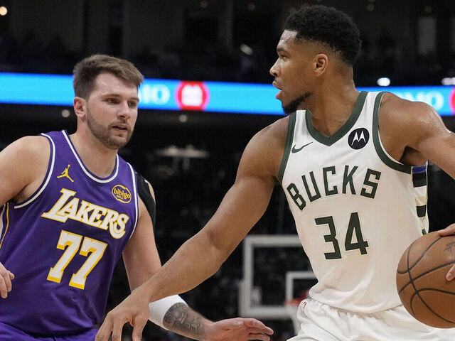 MILWAUKEE, WISCONSIN - NOVEMBER 15: Giannis Antetokounmpo #34 of the Milwaukee Bucks dribbles the ball against Luka Doncic #77 of the Los Angeles Lakers during the third quarter at Fiserv Forum on November 15, 2025 in Milwaukee, Wisconsin.