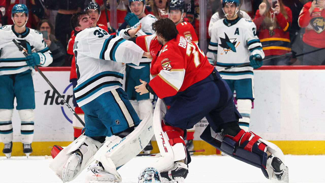 SUNRISE, FLORIDA - JANUARY 19: Alex Nedeljkovic #33 of thea San Jose Sharks and Sergei Bobrovsky #72 of the Florida Panthers fight during the third period at Amerant Bank Arena on January 19, 2026 in Sunrise, Florida.