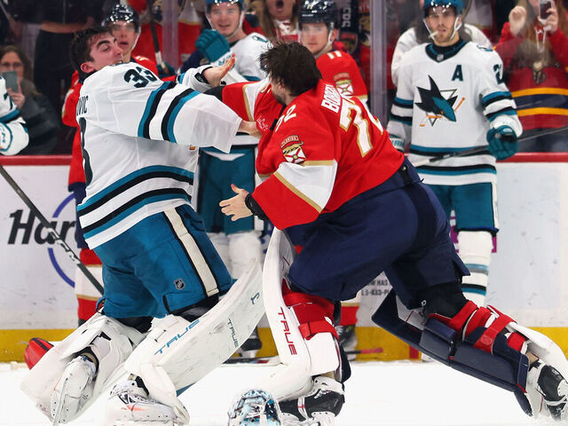 SUNRISE, FLORIDA - JANUARY 19: Alex Nedeljkovic #33 of thea San Jose Sharks and Sergei Bobrovsky #72 of the Florida Panthers fight during the third period at Amerant Bank Arena on January 19, 2026 in Sunrise, Florida.