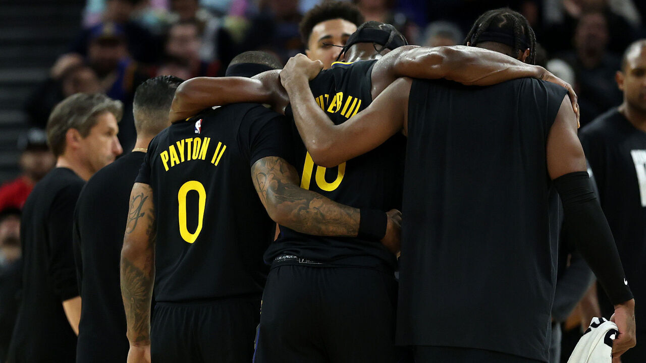 SAN FRANCISCO, CALIFORNIA - JANUARY 19: Jimmy Butler III #10 of the Golden State Warriors is helped off the court after he collided with Davion Mitchell #45 of the Miami Heat and injured his knee during the third quarter at Chase Center on January 19, 2026 in San Francisco, California. NOTE TO USER: User expressly acknowledges and agrees that, by downloading and/or using this photograph, user is consenting to the terms and conditions of the Getty Images License Agreement.