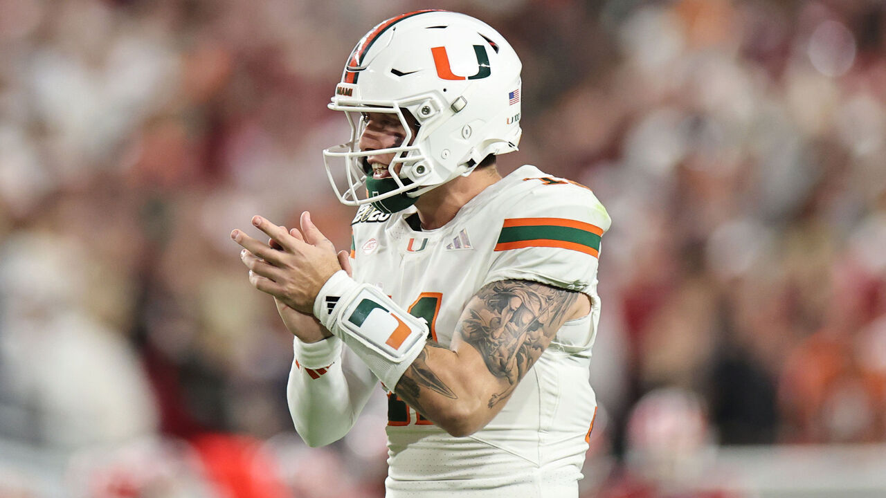 MIAMI GARDENS, FLORIDA - JANUARY 19: Carson Beck #11 celebrates as Mark Fletcher Jr. #4 of the Miami Hurricanes scores a third quarter touchdown against the Indiana Hoosiers in the 2026 College Football Playoff National Championship at Hard Rock Stadium on January 19, 2026 in Miami Gardens, Florida.