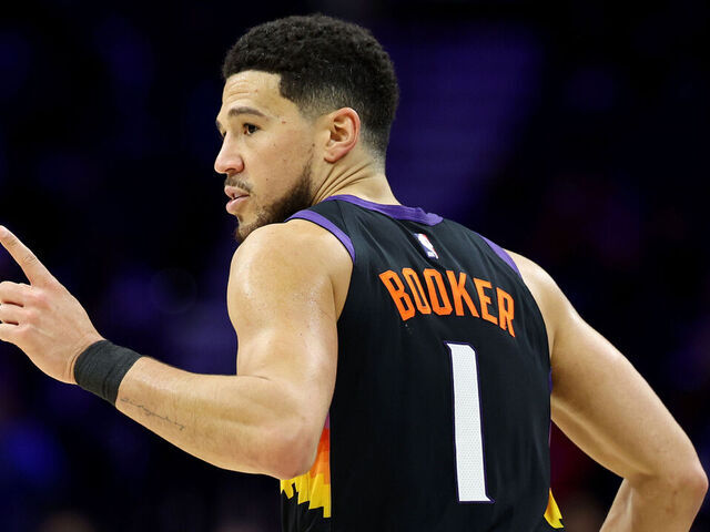 PHILADELPHIA, PENNSYLVANIA - JANUARY 20: Devin Booker #1 of the Phoenix Suns celebrates a three-pointer during the second half against the Philadelphia 76ers at Xfinity Mobile Arena on January 20, 2026 in Philadelphia, Pennsylvania.
