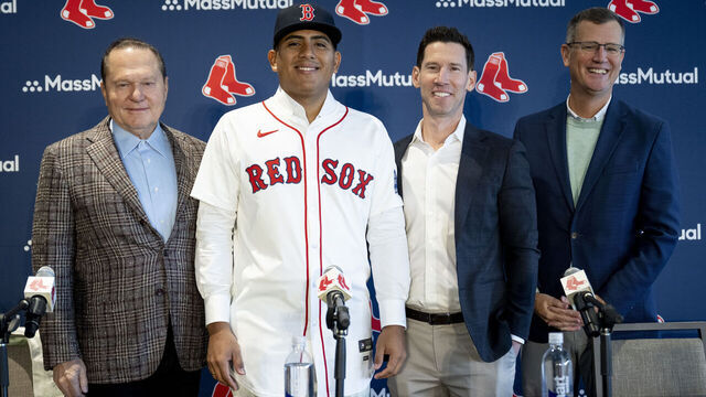 BOSTON, MASSACHUSETTS - JANUARY 21: Ranger Suárez #55 of the Boston Red Sox poses for a photo with Scott Boras, Boston Red Sox Chief Baseball Officer Craig Breslow, and Boston Red Sox President and CEO Sam Kennedy during a press conference announcing his contract agreement with the Boston Red Sox on January 21, 2026 at Fenway Park in Boston, Massachusetts.