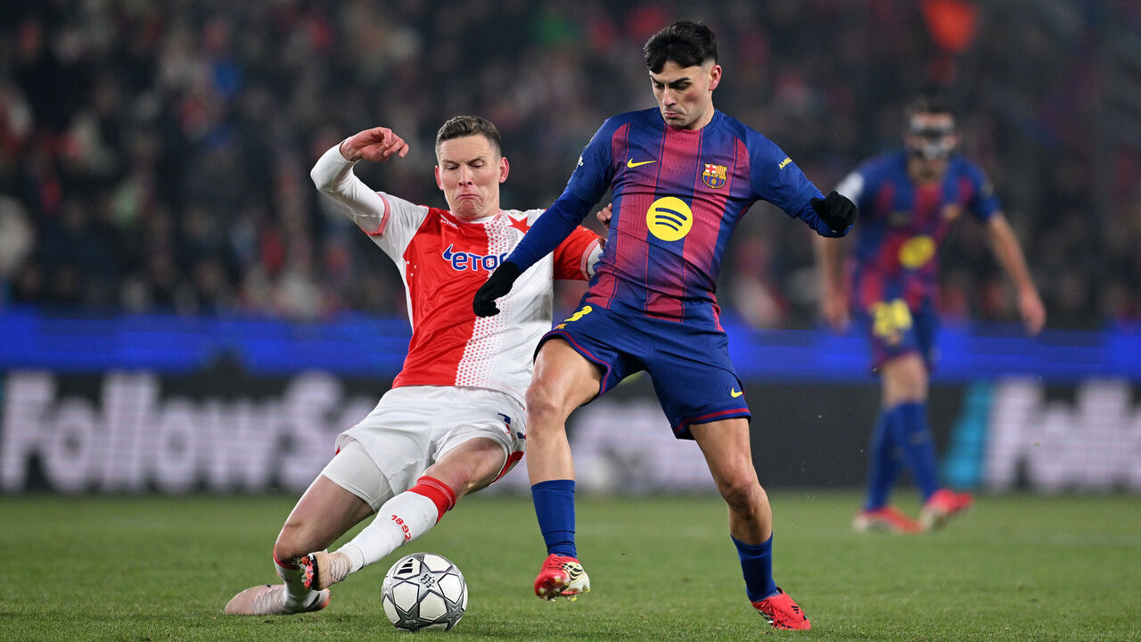 PRAGUE, CZECH REPUBLIC - JANUARY 21: Pedri of FC Barcelona is challenged by Lukas Provod of SK Slavia Praha during the UEFA Champions League 2025/26 League Phase MD7 match between SK Slavia Praha and FC Barcelona at Eden Arena on January 21, 2026 in Prague, Czech Republic.