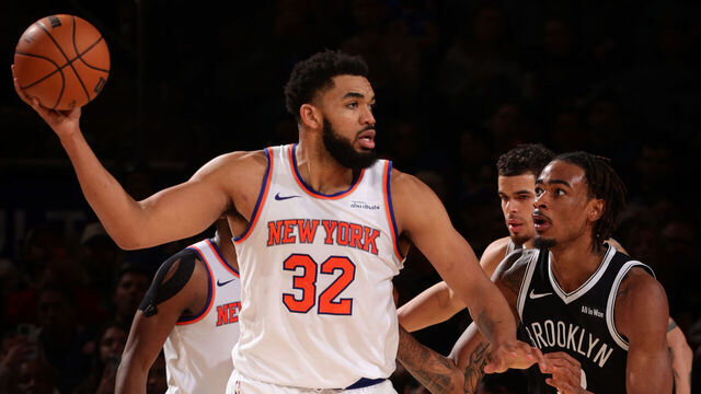 NEW YORK, NY - JANUARY 21: Karl-Anthony Towns #32 of the New York Knicks handles the ball as Nic Claxton #33 of the Brooklyn Nets plays defense during the game on January 21, 2026 at Madison Square Garden in New York City, New York. Mandatory Copyright Notice: Copyright 2026 NBAE
