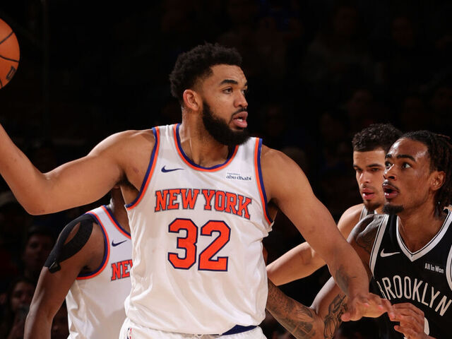 NEW YORK, NY - JANUARY 21: Karl-Anthony Towns #32 of the New York Knicks handles the ball as Nic Claxton #33 of the Brooklyn Nets plays defense during the game on January 21, 2026 at Madison Square Garden in New York City, New York. Mandatory Copyright Notice: Copyright 2026 NBAE