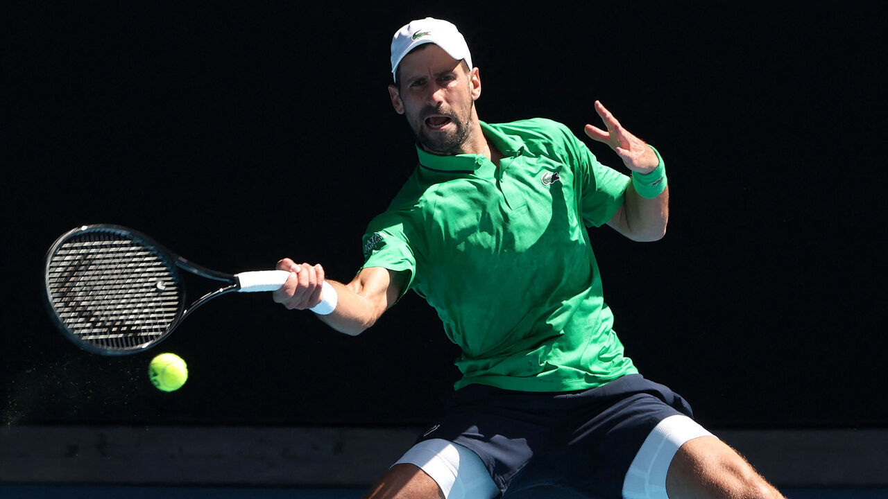 Serbia's Novak Djokovic hits a return to Italy's Francesco Maestrelli during their men's singles match on Day 5 of the Australian Open tennis tournament in Melbourne on January 22, 2026. / -- IMAGE RESTRICTED TO EDITORIAL USE - STRICTLY NO COMMERCIAL USE --