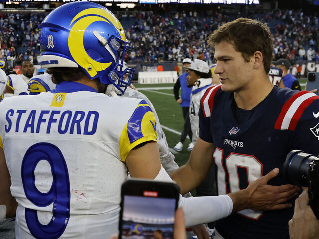 FOXBOROUGH, MA - NOVEMBER 17: New England Patriots quarterback Drake Maye (10) greets Los Angeles Rams quarterback Matthew Stafford (9) after a game between the New England Patriots and the Los Angeles Rams on November 17, 2024, at Gillette Stadium in Foxborough, Massachusetts.