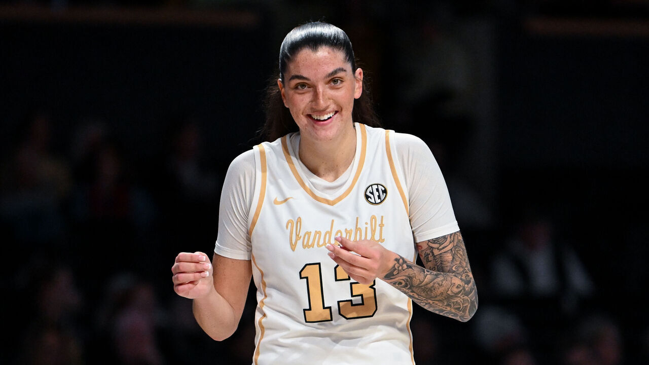NASHVILLE, TENNESSEE - JANUARY 22: Justine Pissott #13 of the Vanderbilt Commodores smiles on the sideline in the first half against the Auburn Tigers at Vanderbilt University Memorial Gymnasium on January 22, 2026 in Nashville, Tennessee.