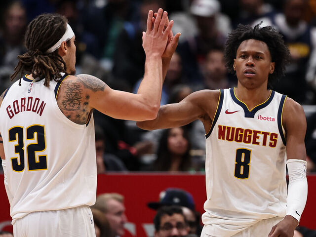 WASHINGTON, DC - JANUARY 22: Peyton Watson #8 of the Denver Nuggets celebrates with Aaron Gordon #32 after a play against the Washington Wizards during the second half at Capital One Arena on January 22, 2026 in Washington, DC.