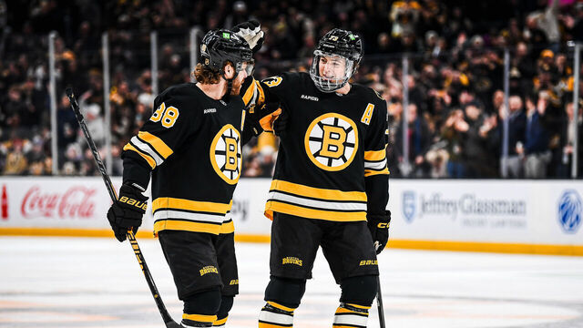 BOSTON, MASSACHUSETTS - JANUARY 22: Charlie McAvoy #73 of the Boston Bruins celebrates his first period goal with David Pastrnak #88 against the Vegas Golden Knights at TD Garden on January 22, 2026 in Boston, Massachusetts.