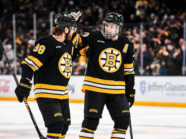 BOSTON, MASSACHUSETTS - JANUARY 22: Charlie McAvoy #73 of the Boston Bruins celebrates his first period goal with David Pastrnak #88 against the Vegas Golden Knights at TD Garden on January 22, 2026 in Boston, Massachusetts.