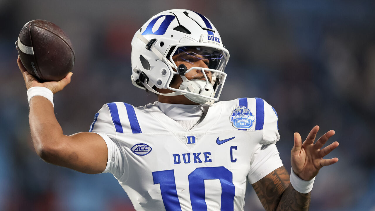 CHARLOTTE, NORTH CAROLINA - DECEMBER 6: Darian Mensah #10 of the Duke Blue Devils throws a pass during warm ups against the Virginia Cavaliers before the ACC Championship game at Bank of America Stadium on December 6, 2025 in Charlotte, North Carolina.