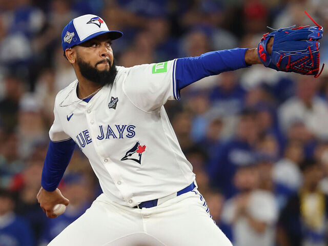 TORONTO, ONTARIO - NOVEMBER 01: Seranthony Domínguez #48 of the Toronto Blue Jays pitches during the tenth inning against the Los Angeles Dodgers in game seven of the 2025 World Series at Rogers Center on November 01, 2025 in Toronto, Ontario.
