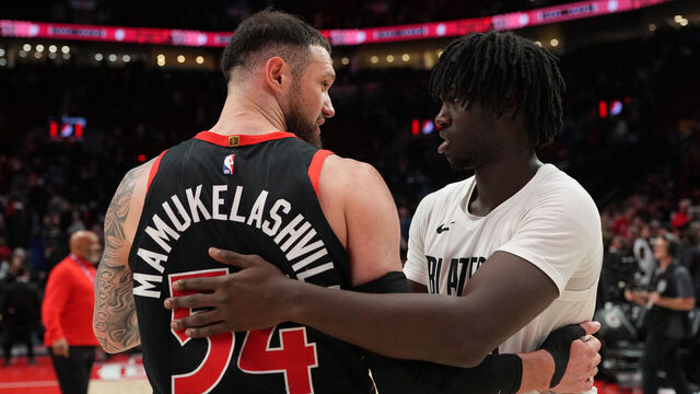 PORTLAND, OREGON - JANUARY 23: Sandro Mamukelashvili #54 of the Toronto Raptors and Sidy Cissoko #91 of the Portland Trail Blazers greet each other after the game at Moda Center on January 23, 2026 in Portland, Oregon.