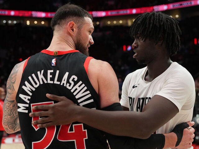 PORTLAND, OREGON - JANUARY 23: Sandro Mamukelashvili #54 of the Toronto Raptors and Sidy Cissoko #91 of the Portland Trail Blazers greet each other after the game at Moda Center on January 23, 2026 in Portland, Oregon.