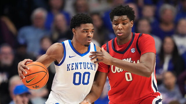 LEXINGTON, KENTUCKY - JANUARY 24: Otega Oweh #00 of the Kentucky Wildcats dribbles the ball while being guarded by Malik Dia #0 of the Ole Miss Rebels in the first half at Rupp Arena on January 24, 2026 in Lexington, Kentucky.