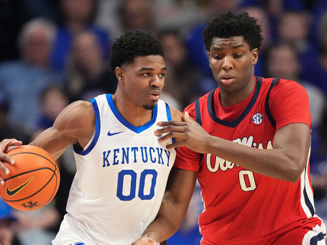 LEXINGTON, KENTUCKY - JANUARY 24: Otega Oweh #00 of the Kentucky Wildcats dribbles the ball while being guarded by Malik Dia #0 of the Ole Miss Rebels in the first half at Rupp Arena on January 24, 2026 in Lexington, Kentucky.
