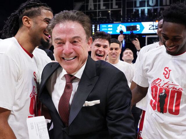 CINCINNATI, OHIO - JANUARY 24: Head coach Rick Pitino of the St. John's Red Storm celebrates with his team following a NCAA basketball game against Xavier Musketeers at Cintas Center on January 24, 2026 in Cincinnati, Ohio. This was Patino's 900th career win.