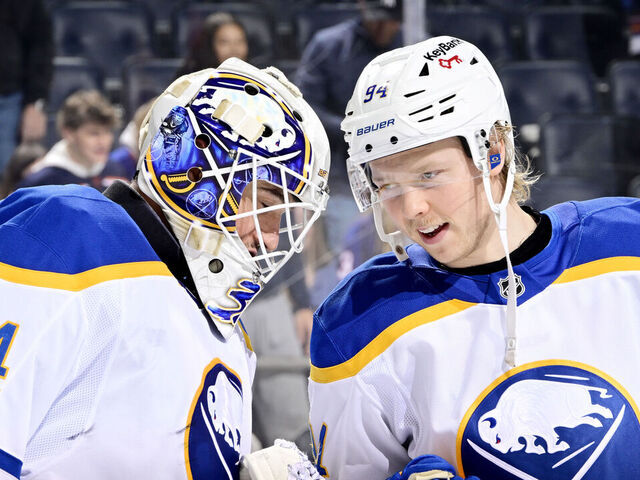 ELMONT, NEW YORK - JANUARY 24: Alex Lyon #34 celebrates the 5-0 shutout victory over the New York Islanders with Konsta Helenius #94 of the Buffalo Sabres at UBS Arena on January 24, 2026 in Elmont, New York.