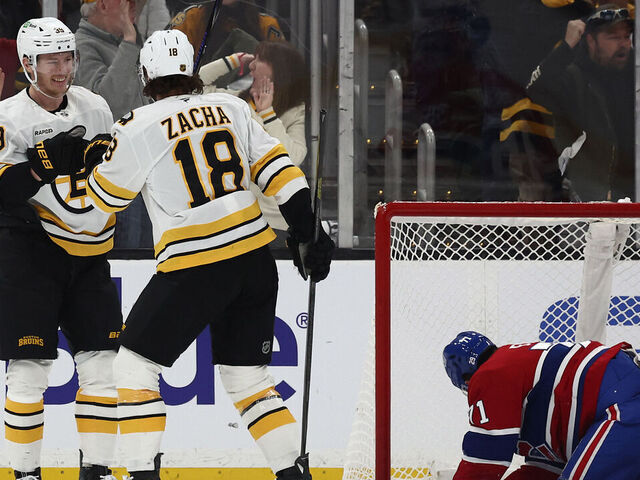 BOSTON, MA - JANUARY 24: With Jake Evans #71 of the Montréal Canadiens down in the crease, Morgan Geekie #39 of the Boston Bruins celebrates his goal with Pavel Zacha #18 during the second period at TD Garden on January 24, 2026 in Boston, Massachusetts.
