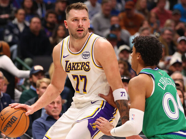 DALLAS, TEXAS - JANUARY 24: Luka Doncic #77 of the Los Angeles Lakers drives against Max Christie #00 of the Dallas Mavericks during the first quarter at American Airlines Center on January 24, 2026 in Dallas, Texas.