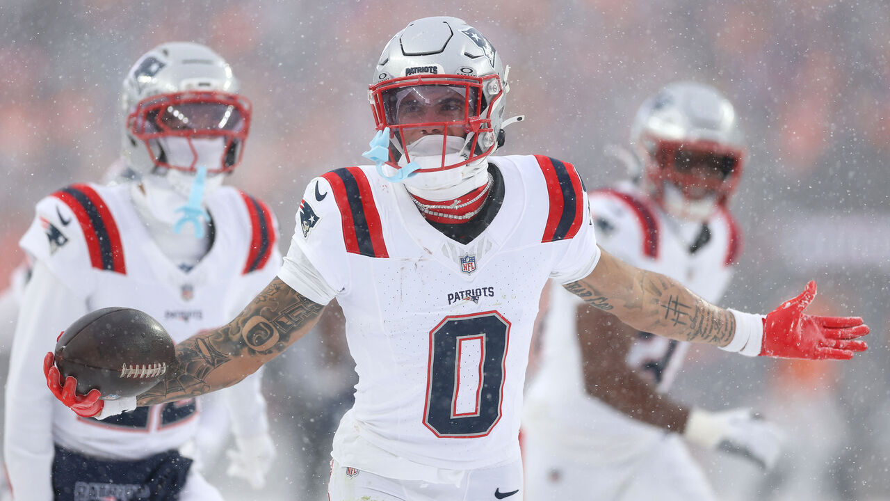 DENVER, COLORADO - JANUARY 25: Christian Gonzalez #0 of the New England Patriots celebrates with teammates after intercepting a pass from Jarrett Stidham #8 of the Denver Broncos (not pictured) intended for Marvin Mims Jr. #19 (not pictured) during the fourth quarter in the AFC Championship Playoff game at Empower Field At Mile High on January 25, 2026 in Denver, Colorado. The New England Patriots defeat the Denver Broncos 10-7.